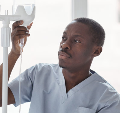 A male caregiver monitoring his client