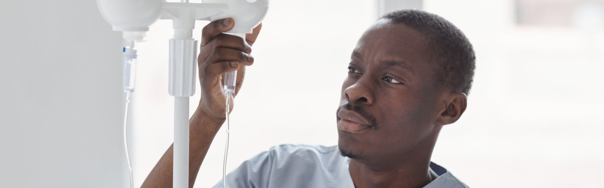 A male caregiver monitoring his client